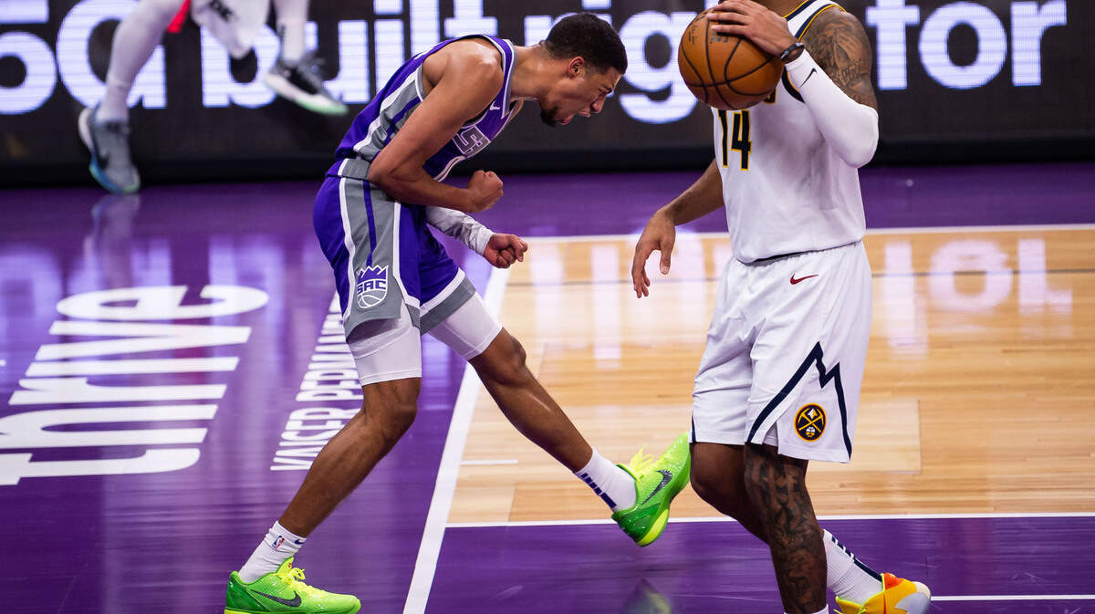 Sacramento Kings guard Tyrese Haliburton (0) celebrates scoring on a fast break past Denver Nuggets guard Gary Harris (14) after a turnover by Sacramento Kings forward Harrison Barnes (40) during a rally in the fourth period of the NBA game Tuesday, Dec. 29, 2020, at Golden 1 Center in Sacramento. The Kings beat the Nuggets 125-115.
