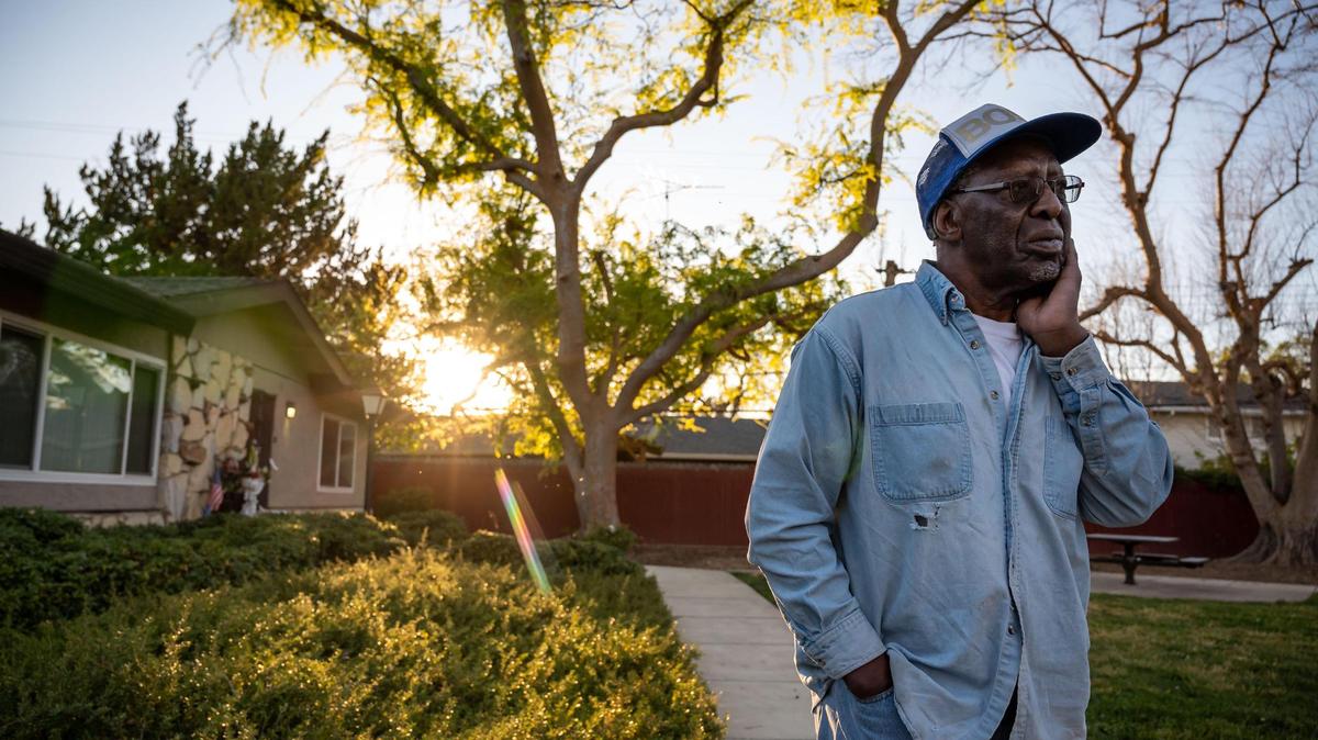Paul Nickson stands outside his home at Mutual Housing at Glen Ellen, where he has lived for 16 years, on March 11 in south Sacramento. Tenants said a new on-site manager harasses them based on their racial identities, has increased citations for petty lease violations and violates their privacy on a daily basis.
