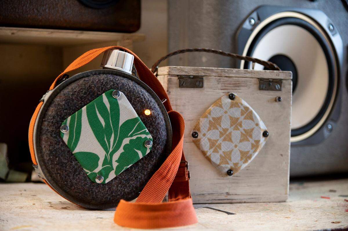 Kaden Hill of Rare Bird Stereos crafts bluetooth speaker cabinets out of vintage items he’s found thrifting, like this old canteen, wood box and an old airline pilot’s suitcase made of fiberglass.