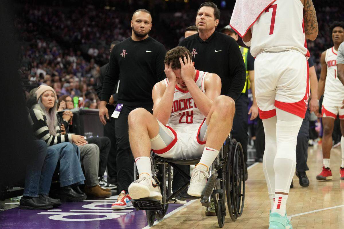 Houston Rockets center Alperen Sengun (28) is wheeled off of the court after suffering an injury against the Sacramento Kings during the fourth quarter Sunday, March 10, 2024, at Golden 1 Center.
