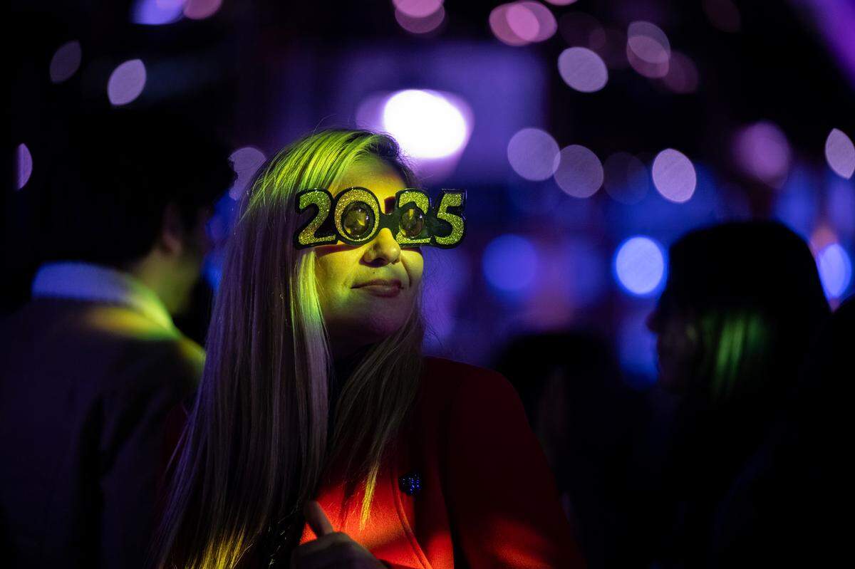 Alejandra Flores of Lodi dances to music played by DJ Epic at the New Year’s Eve celebration on K Street in Old Sacramento on Tuesday night.