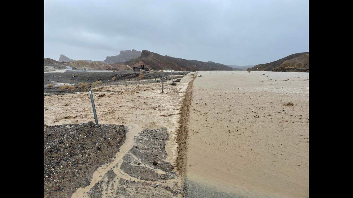Floodwater rushes across California 190 near Zabriskie Point in Death Valley.