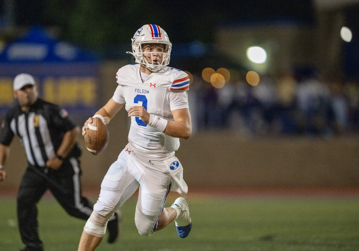 Folsom Bulldogs' quarterback Ryder Lyons (3) moves out of the pocket as he looks for a receiver against the Grant Pacers in the first half on Saturday, Aug. 23, 2025, in Del Paso Heights.