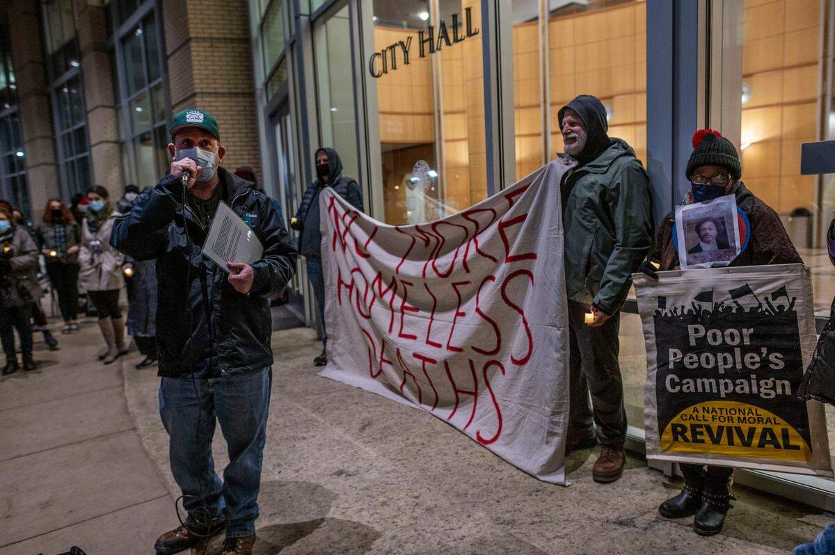 Joseph Smith, advocacy director at Loaves & Fishes, speaks about homeless friends who died in 2021 during a memorial candlelight vigil in December.