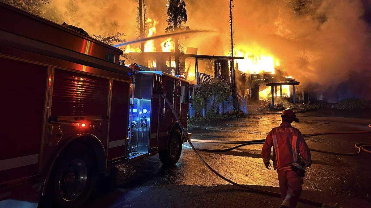 Firefighters with Cal Fire SHU battle flames at the Pizza Pub, part of the Silverthorn Resort on Sunday, July 7. Firefighters were able to control the flames before the fire spread, but the legendary restaurant once owned by Merle Haggard was destroyed.