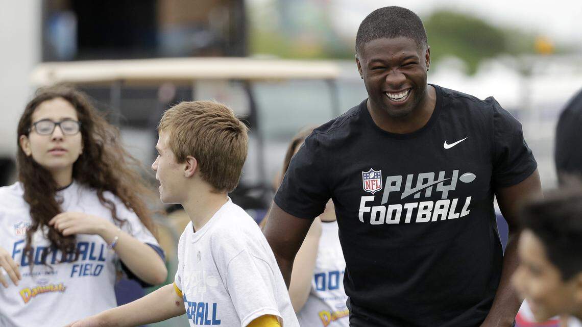 Roquan Smith, a linebacker from Georgia, laughs during a Play Football Clinic on Wednesday in Arlington, Texas. He's expected to be smiling again Thursday during the first round of the NFL draft.