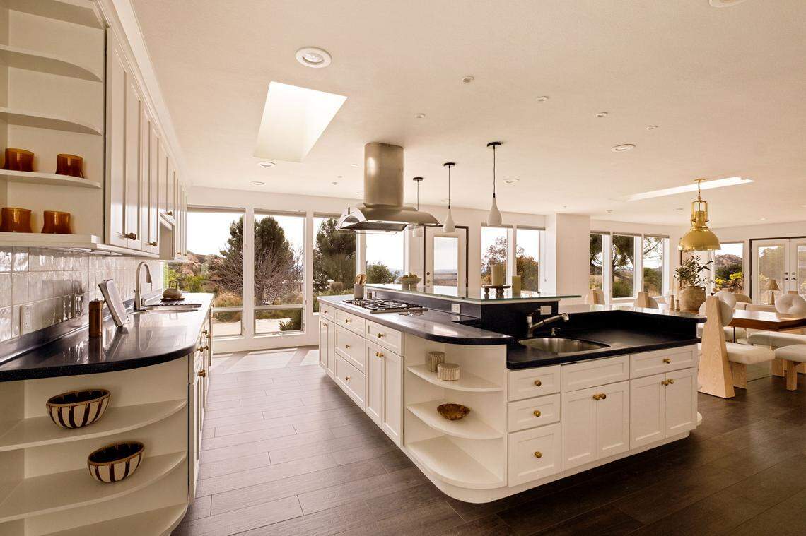 Inside, the open-concept design of the Earthship residence showcases a gourmet Thermador kitchen, a sunlit great room with 120 linear feet of energy-efficient windows, and ten operable skylights.