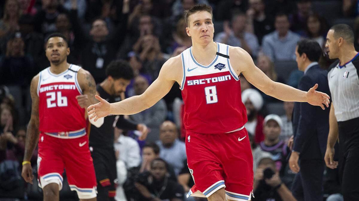 Sacramento Kings guard Bogdan Bogdanovic (8) reacts after scoring a basket over Miami Heat guard Duncan Robinson (55) during a game at the Golden 1 Center on Friday, Feb 7, 2020 in Sacramento.
