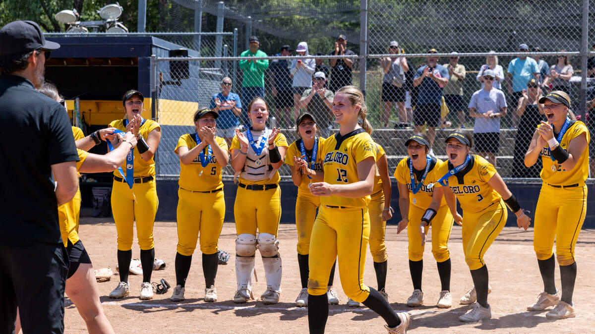 The Del Oro Golden Eagles cheer for pitcher Mikayla Finn, center, as she receives her medal after winning the CIF Northern California Division I softball championship against the Oak Ridge Trojans on Saturday, June 7, at Oak Ridge High School.
