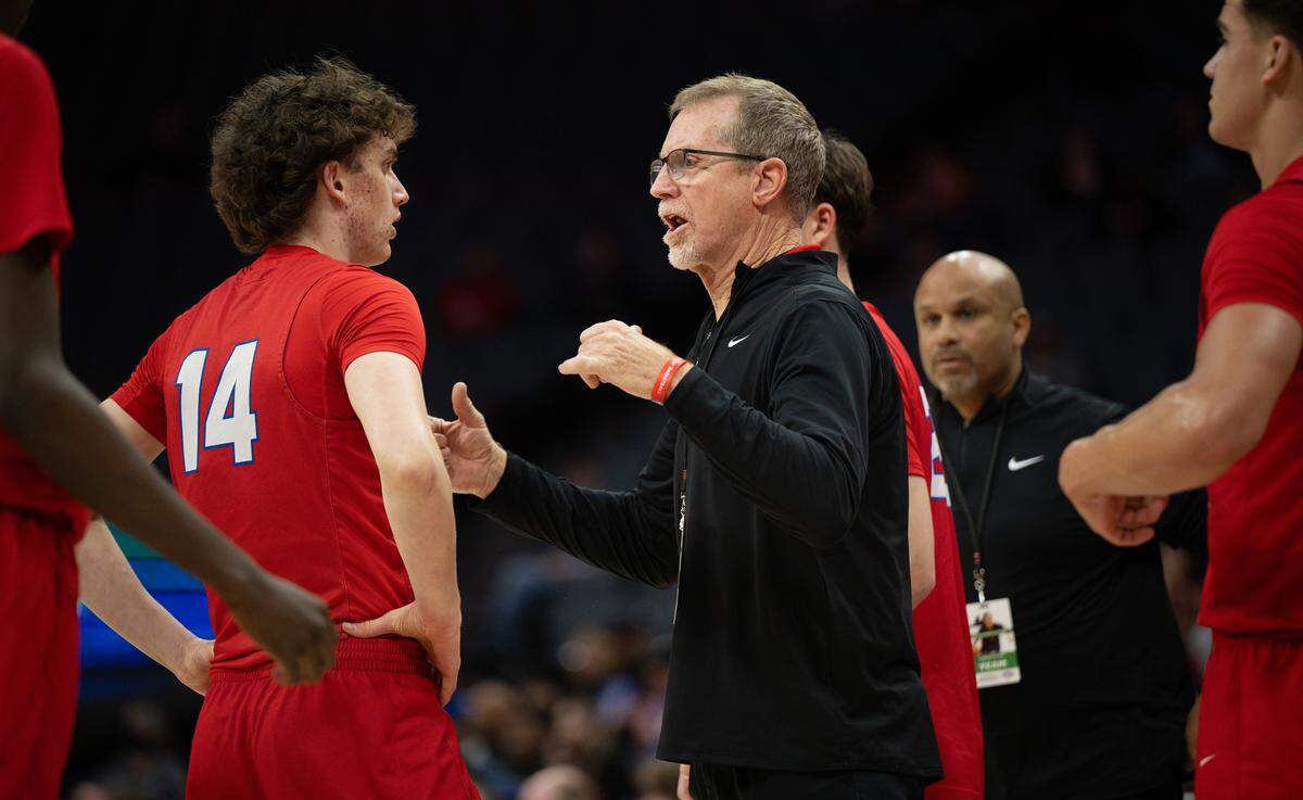 Folsom coach Mike Wall talks with Alec Day during the Sac-Joaquin Section Division I championship game with Modesto Christian at the Golden 1 Center on Friday.