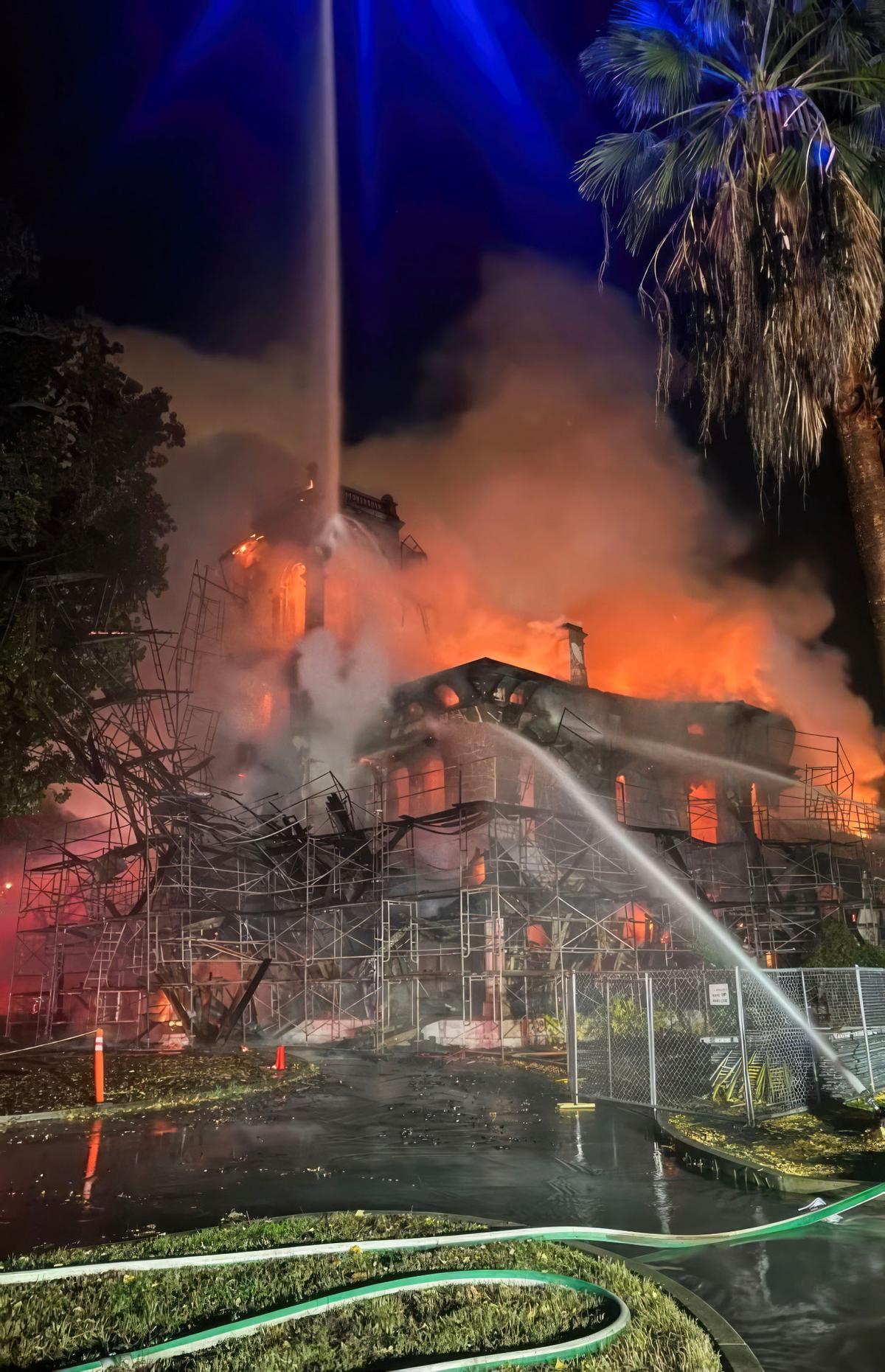Firefighters attempt to extinguish a blaze at the Bidwell Mansion, a California State Historic Park building in Chico, before dawn on Wednesday, Dec. 11, 2024.