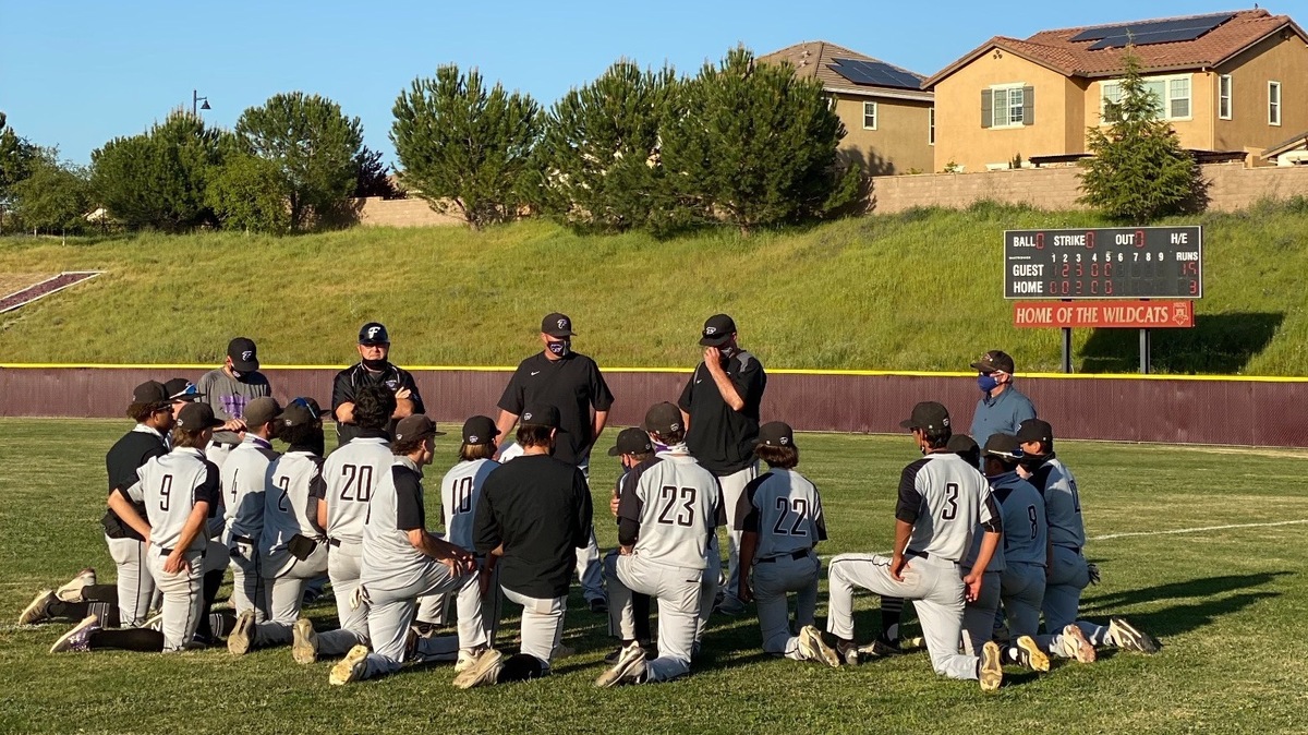 Franklin coach Bryan Kilby talks to his team after a 16-3 win over Whitney in Placer County.
