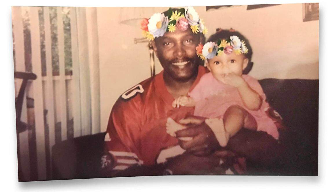 Quinton Watts holds one of his three daughters in a family photo from before the crash.