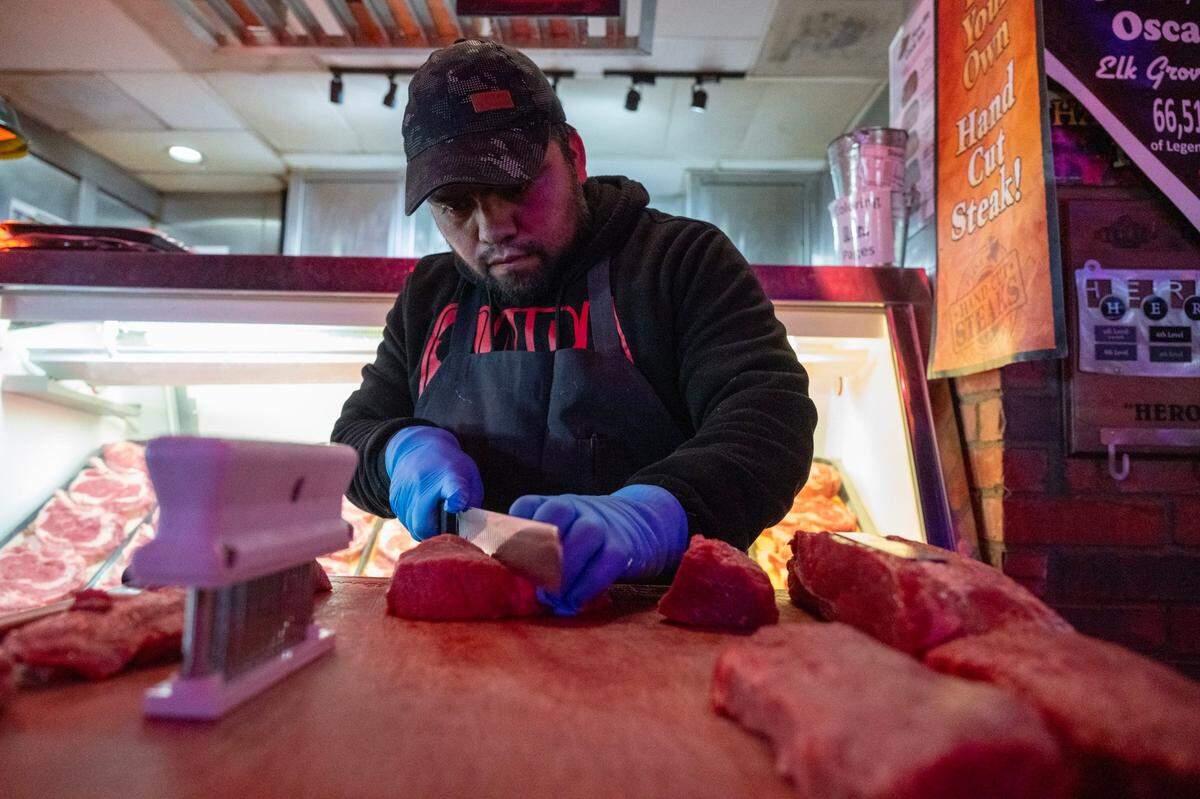 Butcher Oscar Soto prepares cuts of sirloin steak at Texas Roadhouse on Friday, Feb. 2, 2024, in Elk Grove. He is competing in the annual company meat-cutting challenge for Texas Roadhouse.