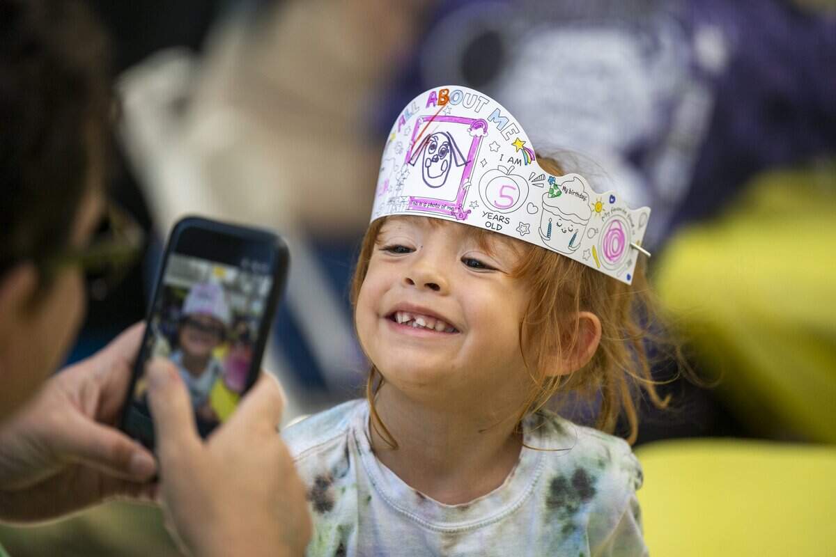 Athena Baca of Vacaville is photographed after decorating a paper tiara at the Banana Festival in Land Park on Saturday, Aug. 15, 2026.