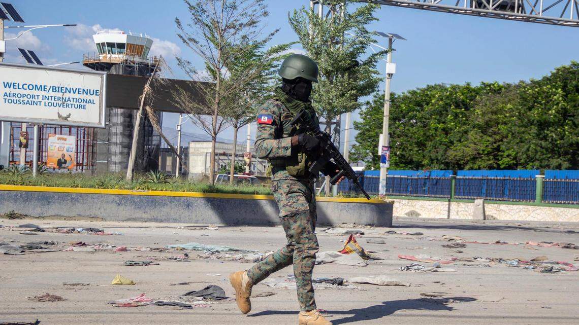 Police and army officers guard Toussaint Louverture international airport in Port-au-Prince, Haiti, in 2024 as the government declared a state of emergency amid violent clashes in the capital that damaged communications and led to two prison escapes.
