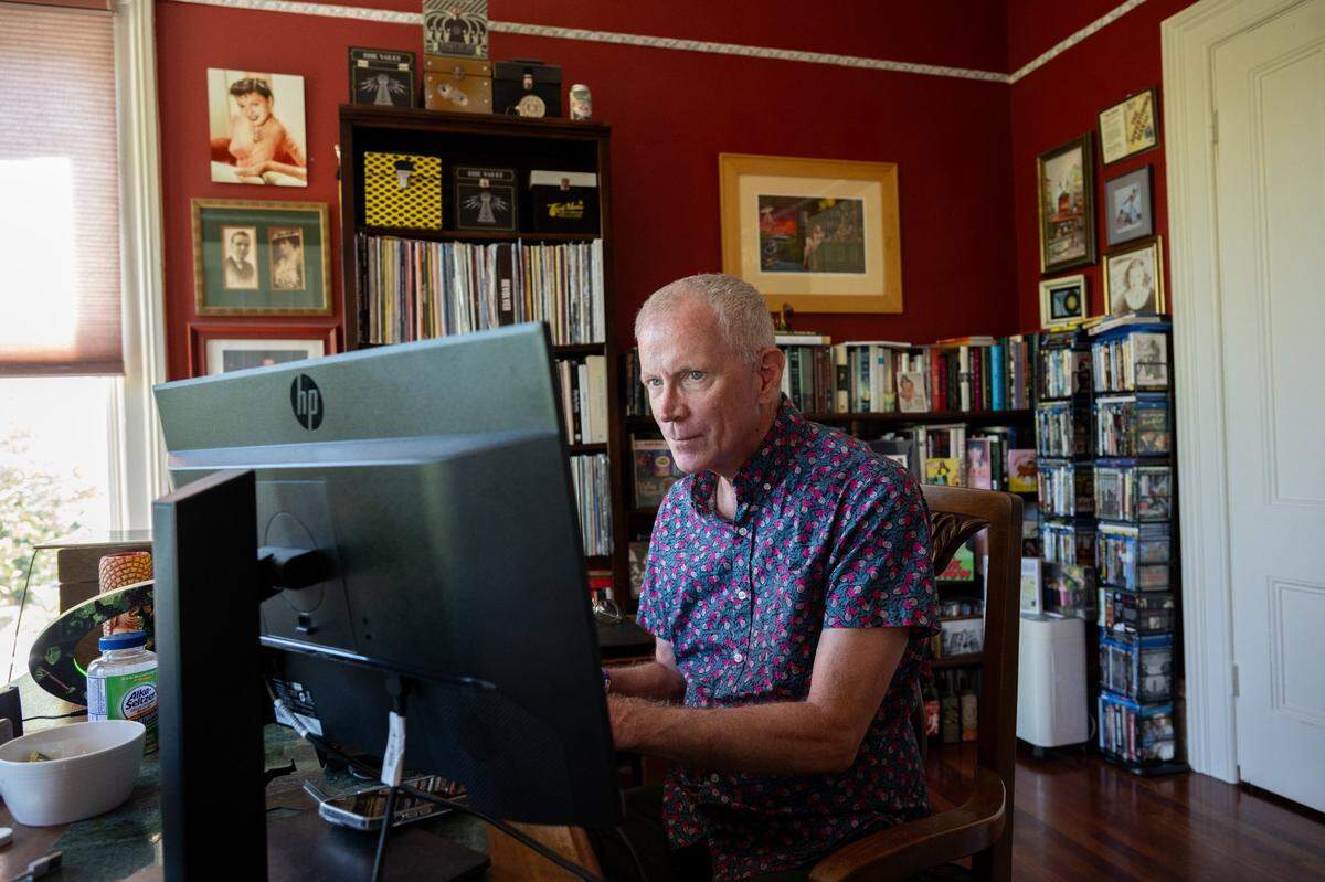 James Fitzpatrick, who’s lived near R Street since 1989, works from his home office July 19. He says he’s seen the neighborhood develop into a vibrant district.