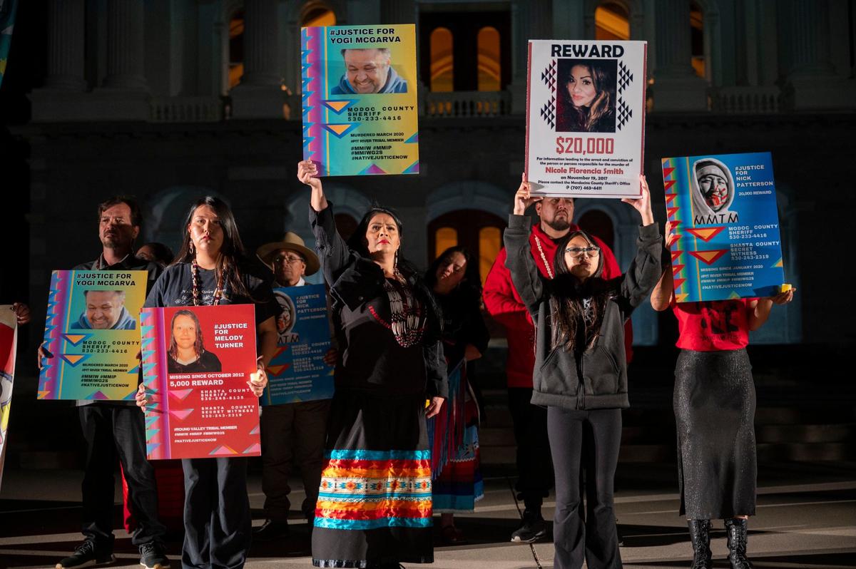Family members hold signs of their lost loved ones during a Missing and Murdered Indigenous People vigil held at the Capitol on Wednesday, May 1, 2024.