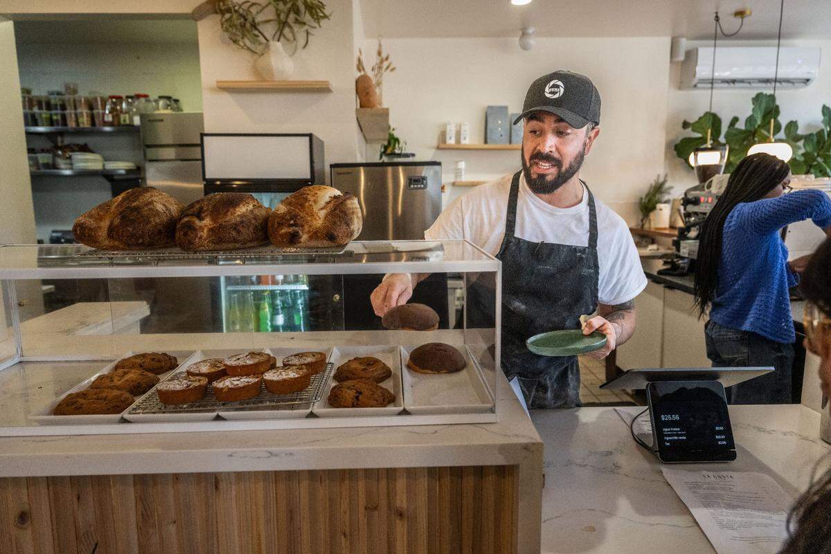 La Costa Cafe chef and owner Ignacio Ortega serves a concha pastry at his cafe last month. The cafe features coffee, seafood dishes and bakery items – making it hybrid-style eatery that Localis sous chef Polo Adamo said could be a trend in the future.