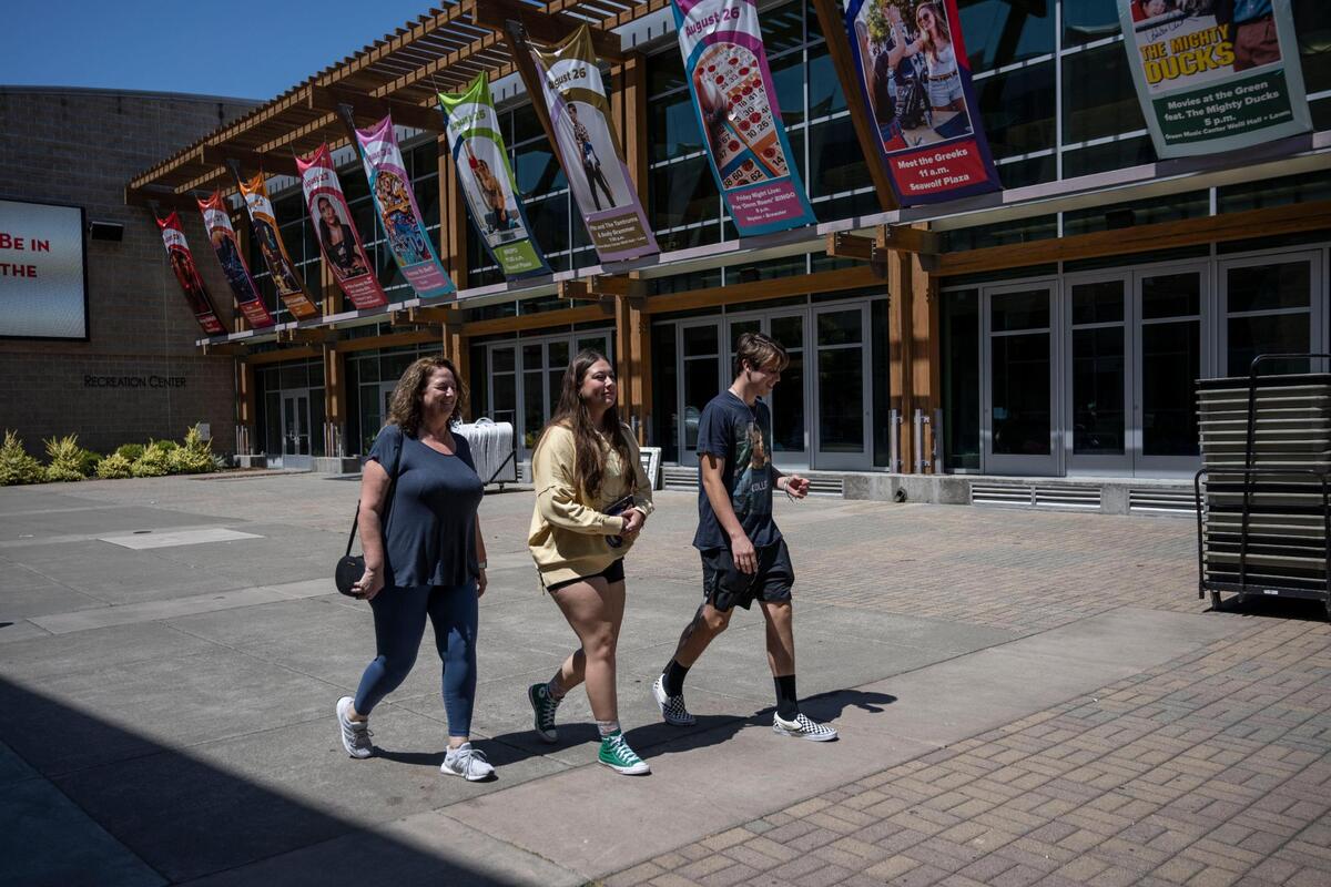Tara McCord, left, of Vacaville, walks by the Recreation Center at Sonoma State during move in day Tuesday with her daughter Falin McCord, an incoming freshman, and her daughter’s boyfriend, Jacoby Crisafulli, who helped with the move.