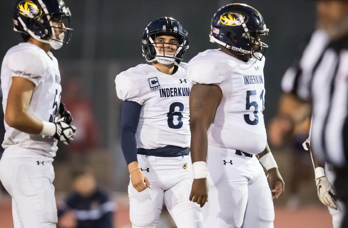 Inderkum Tigers quarterback Ricky Cole (6) gets to work on offense after the Tigers recover a fumble by the Woodcreek Timberwolves during the opening drive of the high school football game Friday, Sept. 22, 2023, at Woodcreek High School in Roseville.