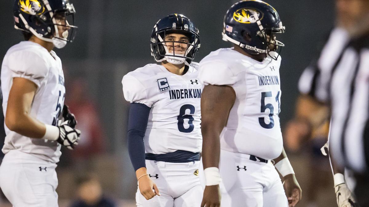 Inderkum Tigers quarterback Ricky Cole (6) gets to work on offense after the Tigers recover a fumble by the Woodcreek Timberwolves during the opening drive of the high school football game Friday, Sept. 22, 2023, at Woodcreek High School in Roseville.