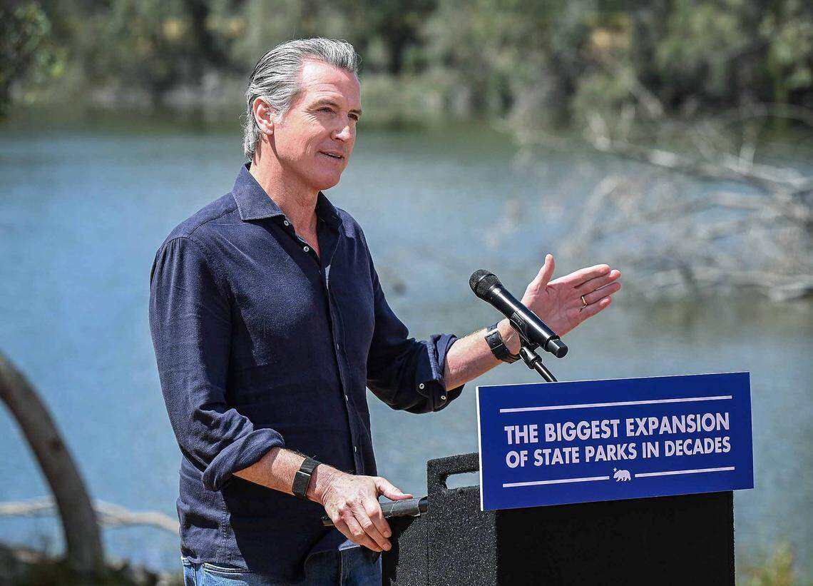 California Gov. Gavin Newsom announces the expansion of the state park system during a news conference near the Sycamore Island fishing dock along the San Joaquin River Parkway in Madera County on Wednesday.