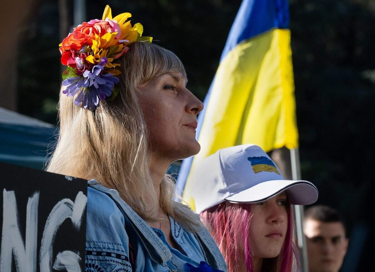 Galyna Shpilman joins in singing the Ukrainian national anthem in front of the state Capitol on Monday. The Shpilmans moved to the United States from Melitopol, Ukraine, and have lived in Sacramento for the past 3-1/2 years.