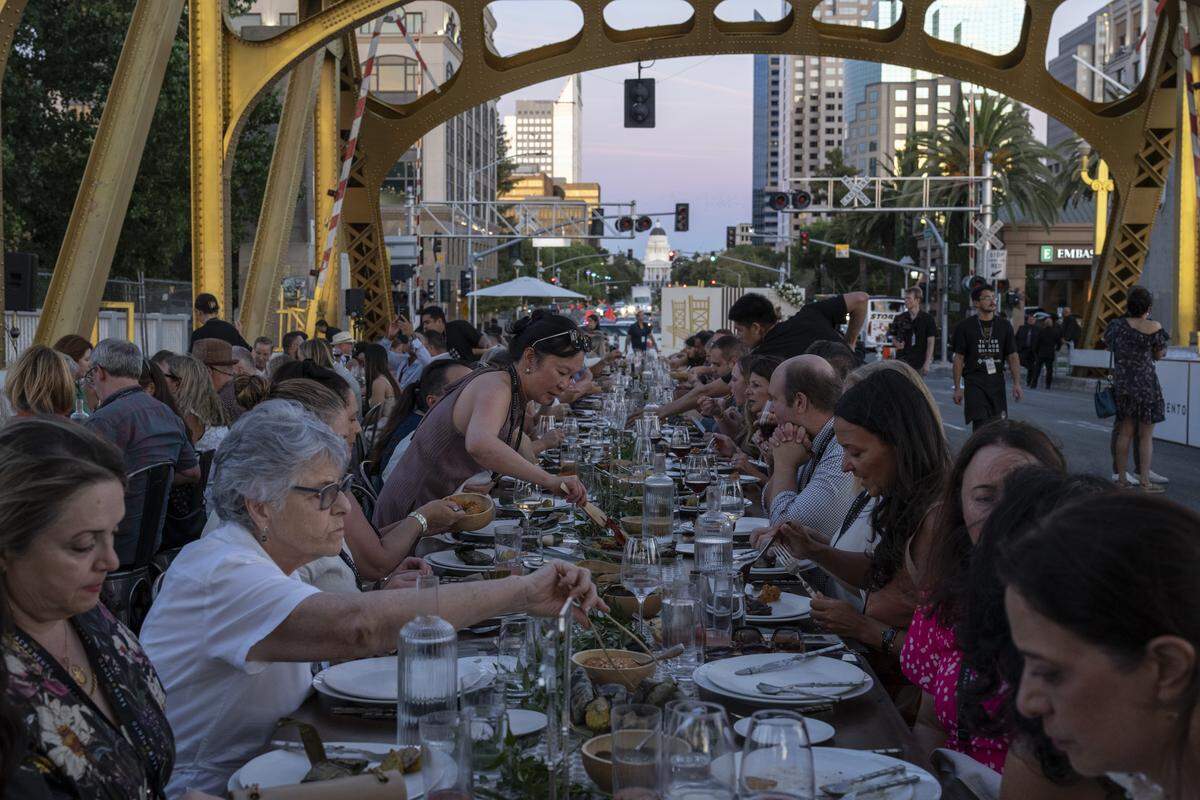 Guests dine on Tower Bridge during the Tower Bridge Dinner on Sunday, Sept. 7, 2025.