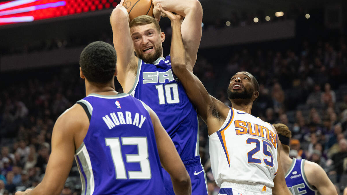 Sacramento Kings forward Domantas Sabonis and Phoenix Suns forward Mikal Bridges (25) battle for rebound during a game at the Golden 1 Center on Monday.