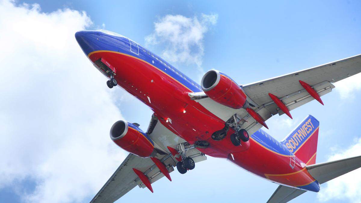 FILE - In a June 6, 2016, file photo, a Southwest Airlines jet gets ready to land at Tampa International Airport, in Tampa, Fla. On Thursday, July 21, 2016, Southwest reports financial results. (Skip O’Rourke/The Tampa Bay Times via AP, File)
