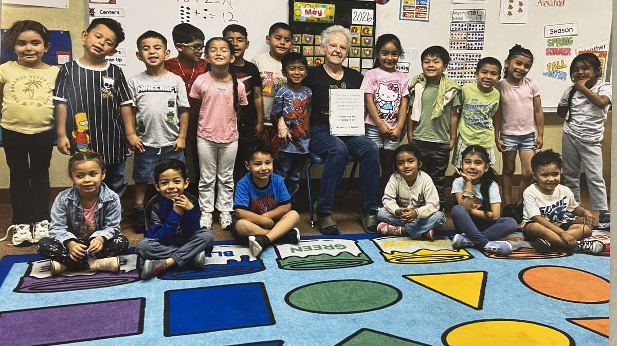 Bunny Stevens, middle, poses with her granddaughter’s transitional kindergarten class.