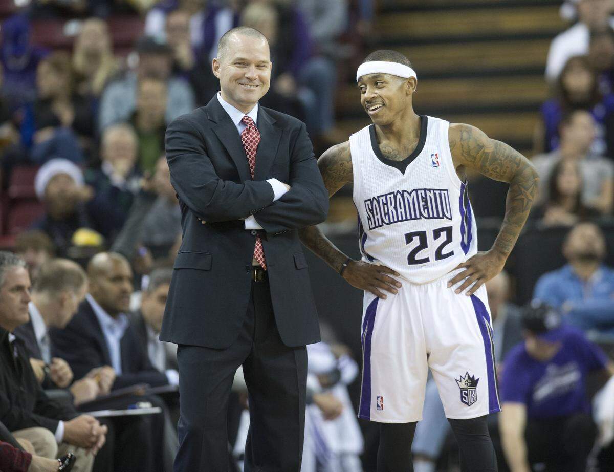 Kings coach Michael Malone talks with guard Isaiah Thomas during a game against the Utah Jazz at Sleep Train Arena on Dec. 11, 2013, in Sacramento.