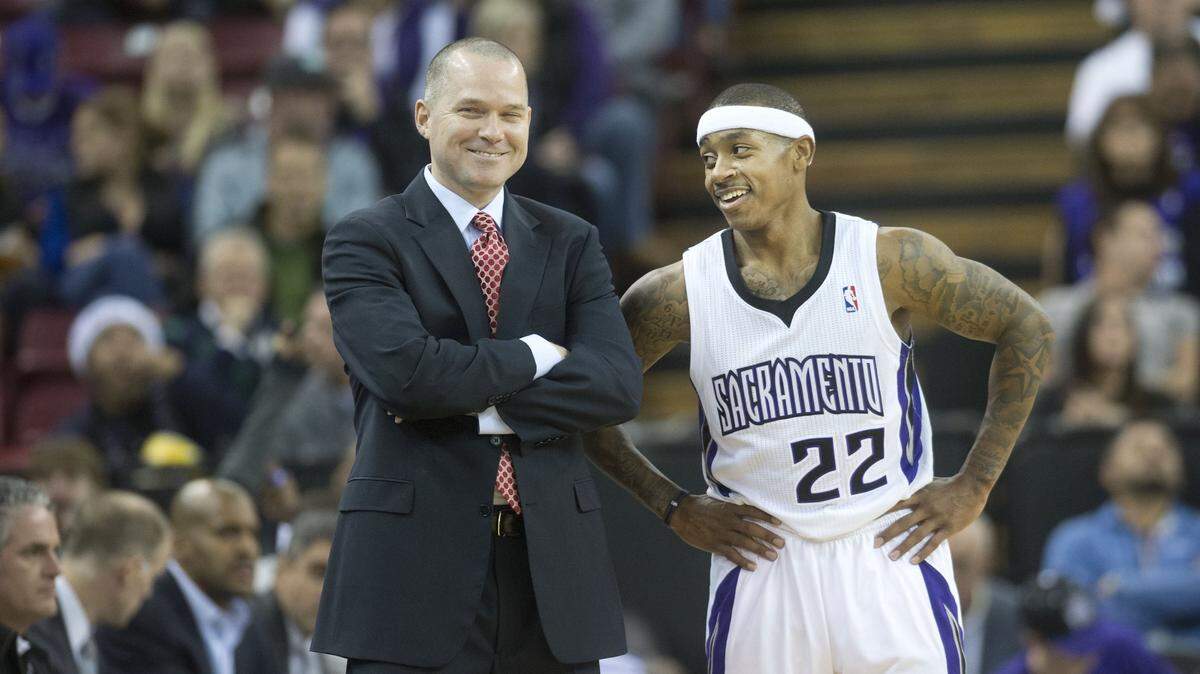 Kings coach Michael Malone talks with guard Isaiah Thomas during a game against the Utah Jazz at Sleep Train Arena on Dec. 11, 2013, in Sacramento. The two will be reunited with the Denver Nuggets, according to an ESPN report.