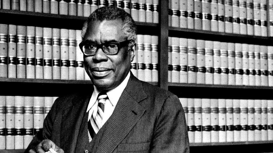 Nathaniel Colley, the first Black attorney in Sacramento, stands in his law library in 1979.