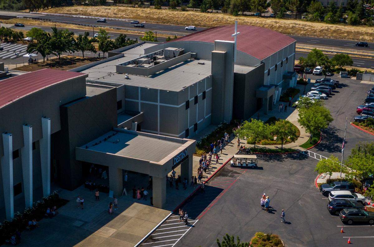Members of Destiny Christian Church line up to go inside the building before the 11 a.m. service in Rocklin on Sunday, July 19, 2020. It was the church’s first day of Sunday services since Gov. Gavin Newsom ordered an end to indoor worship amid a resurgence of coronavirus cases.