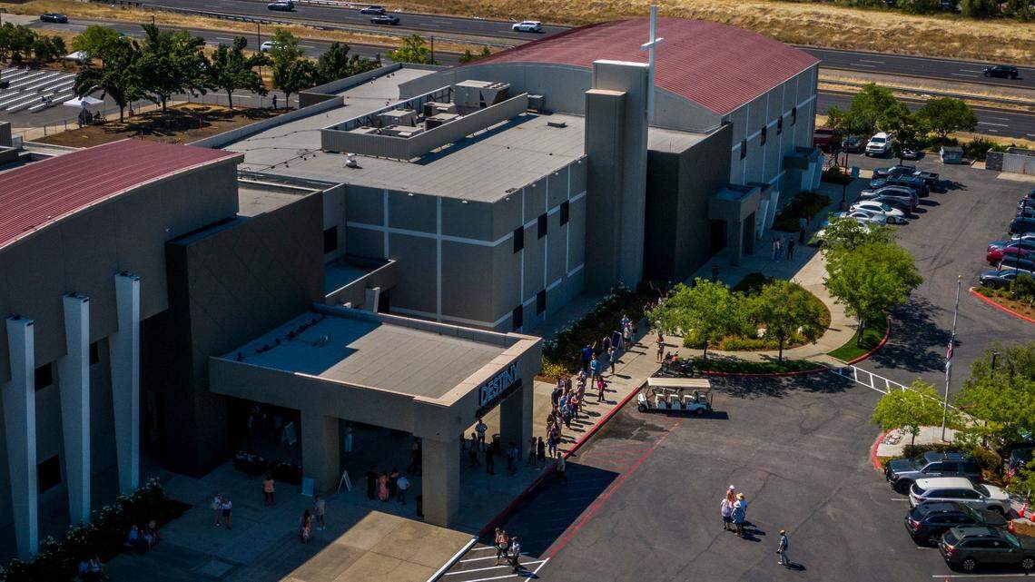 Members of Destiny Christian Church line up to go inside the building before a service in Rocklin in July 2020, in defiance of Gov. Gavin Newsom’s order to end indoor worship amid a resurgence of coronavirus cases.
