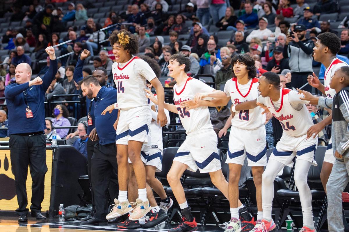 San Joaquin Memorial Panthers sideline cheer as the clock runs out in the CIF State Division II Boys Basketball Championship against the Pacifica Christian Tritons on Saturday, March 11, 2023, at Golden 1 Center in Sacramento. The Panthers defeated the Tritons 58-47.