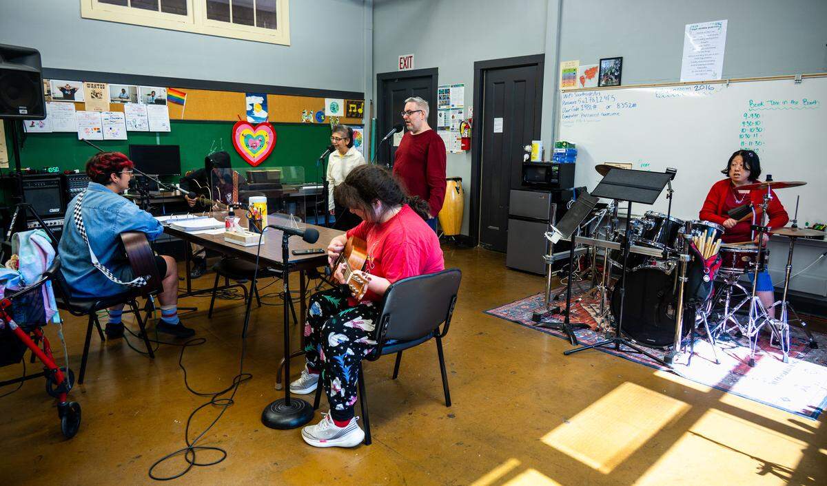 The Early Birds band practices a cover of “Don’t Start Now” by Dua Lipa at the E. Claire Raley Studios for the Performing Arts in Sacramento on July 29, 2025.