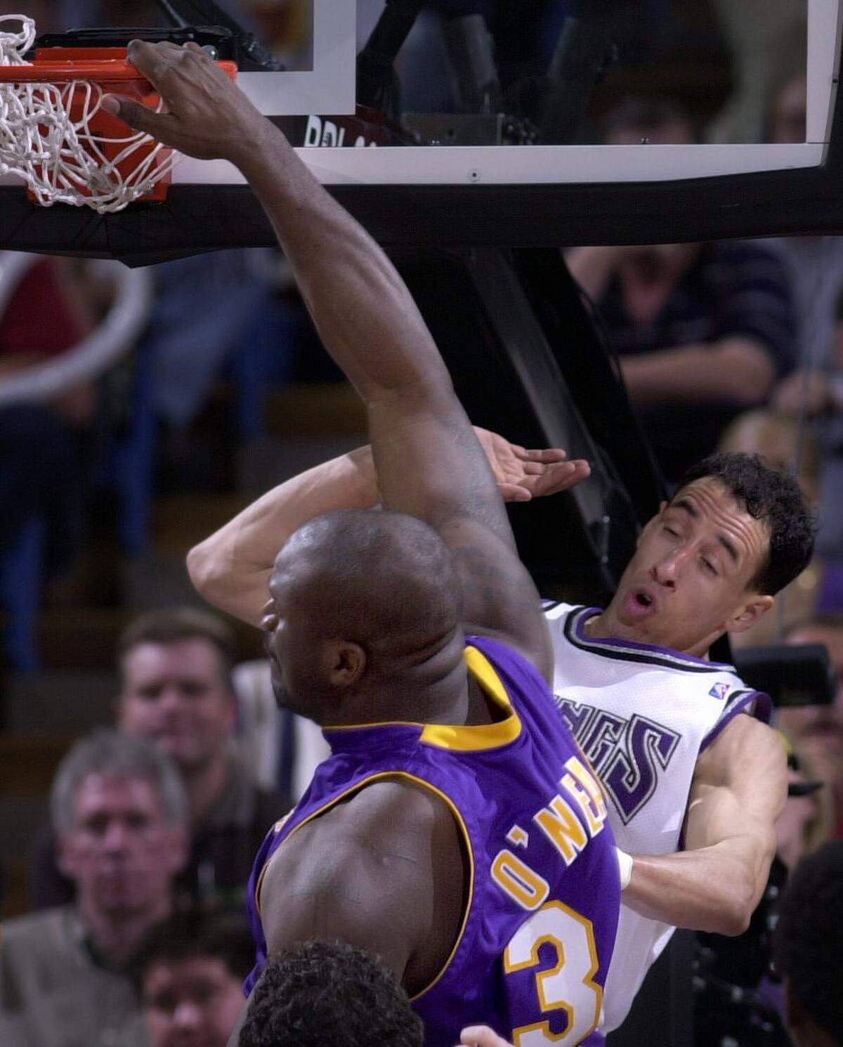 Sacramento Kings’ Doug Christie was unable to block Shaquille O’Neal’s shot and was pushed away as the center made one of his trade mark dunks to lead the Lakers to victory March 25, 2001, at Arco Arena.