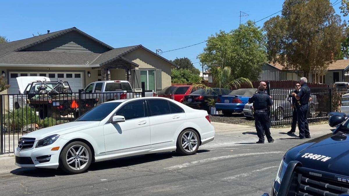 Sacramento police officers respond to a call for a suspicious person with a gun at a Hagginwood house where Councilman Sean Loloee says he lives on Aug. 4, 2021. Police were called to the house six times since November 2019.