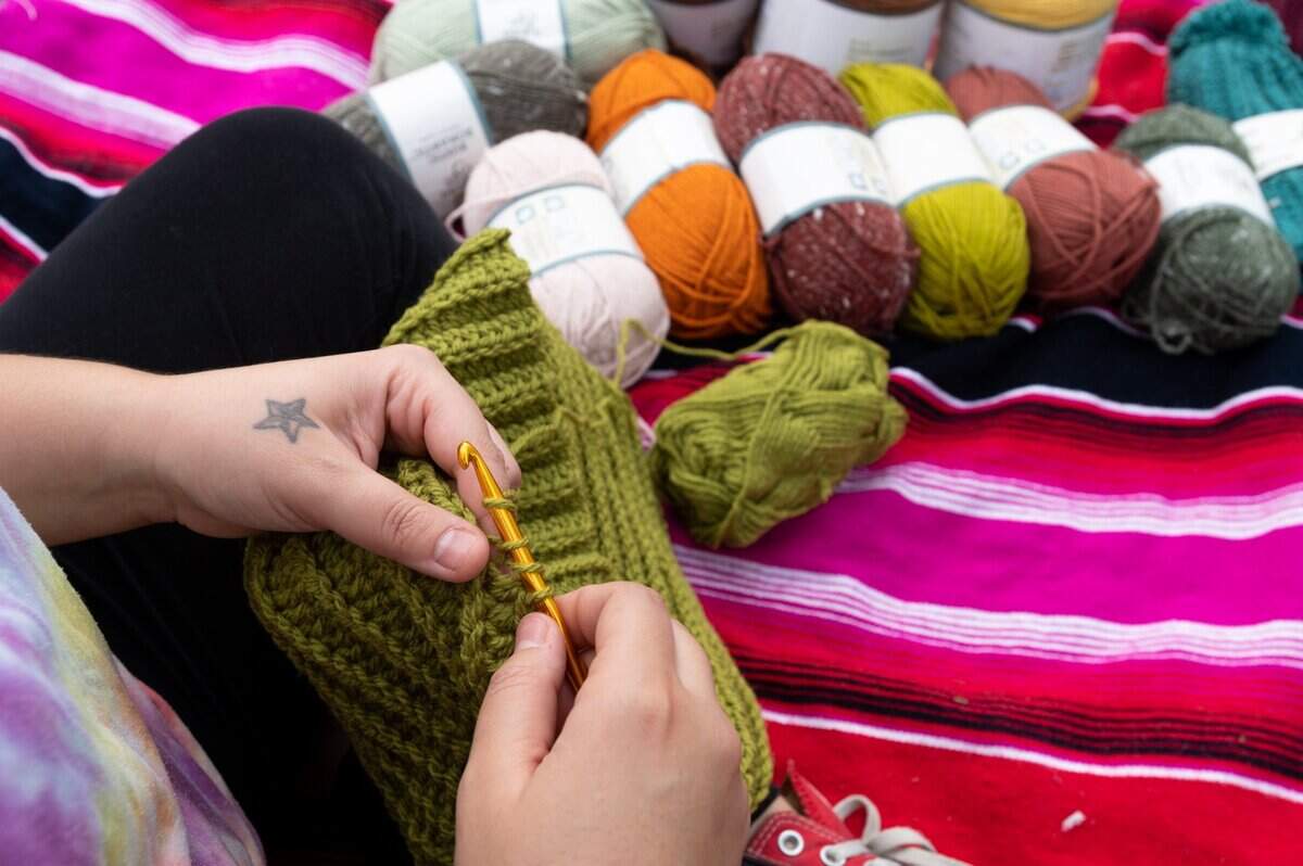 Savanna Muñoz started an online business crocheting beanies called The Hippies Bungalow. She works on her projects at Walerga Park in Foothill Farms on Friday, Aug. 13, where she can watch her daughter play in the park as she makes her products.