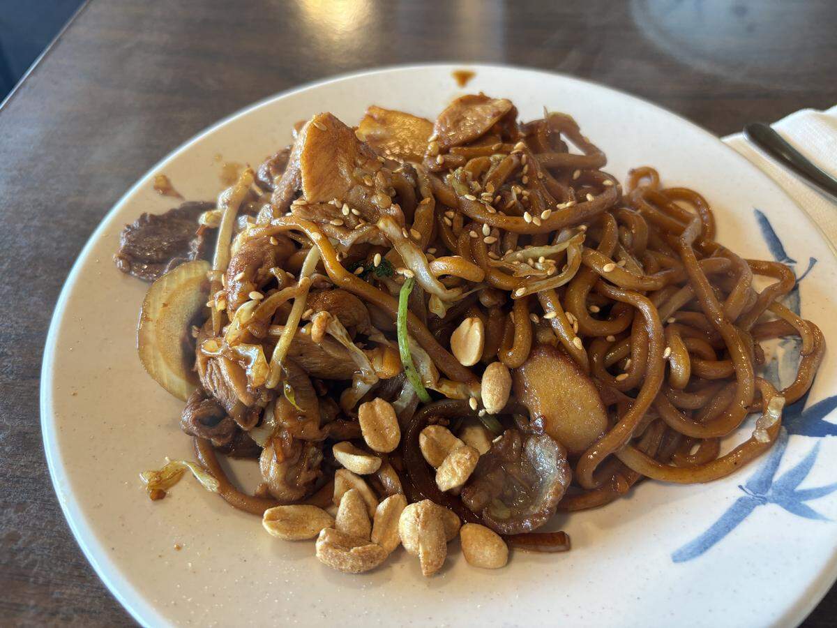 A custom plate of Mongolian barbecue from Li’s Mongolian BBQ in Carmichael includes lamb, dark chicken, noodles, onions, pineapple and cilantro, topped with a number of sauces. Once built, the dish is cooked on a hot stone.