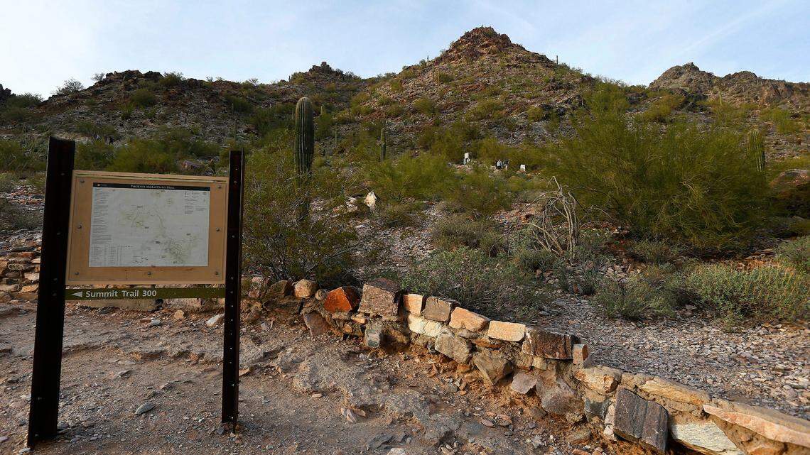 Hikers walk on the Phoenix Mountain Preserve trail up to Piestewa Peak in Phoenix on Tuesday, Jan. 10, 2017. Two different women have died on Arizona trails in July and September 2021 following a separation from their hiking partner.