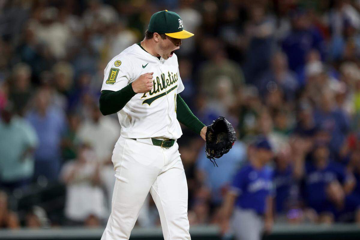 Jul 12, 2025; West Sacramento, California, USA; Athletics pitcher Mason Miller (19) reacts after defeating the Toronto Blue Jays 4-3 at Sutter Health Park. Mandatory Credit: Dennis Lee-Imagn Images