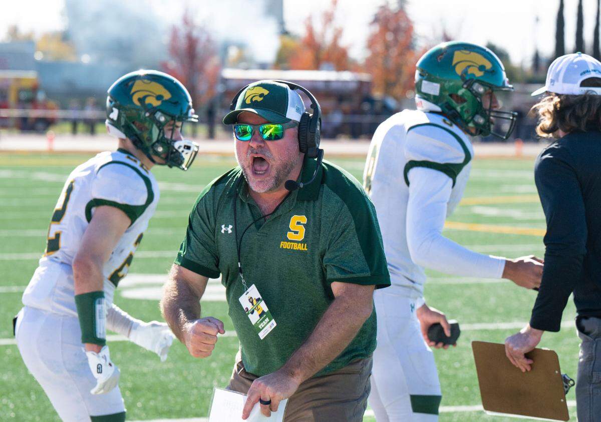 Sonora coach Kirk Clifton reacts to the interception by his defensive back Tanner Navarro (3) against the Bradshaw Christian Pride in the Sac-Joaquin Section Division VI championship game at Hughes Stadium in Sacramento on Friday, Nov. 29, 2024.