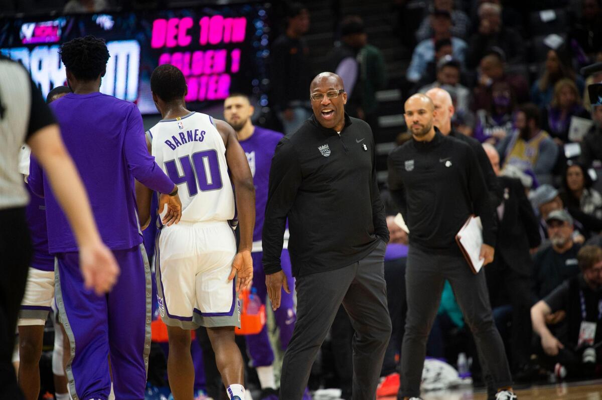 Mike Brown, Sacramento Kings head coach is all smiles after Sacramento Kings forward Harrison Barnes (40) scored a three point basket against the Chicago Bulls on Sunday during an NBA basketball game at Golden 1 Center in Sacramento.