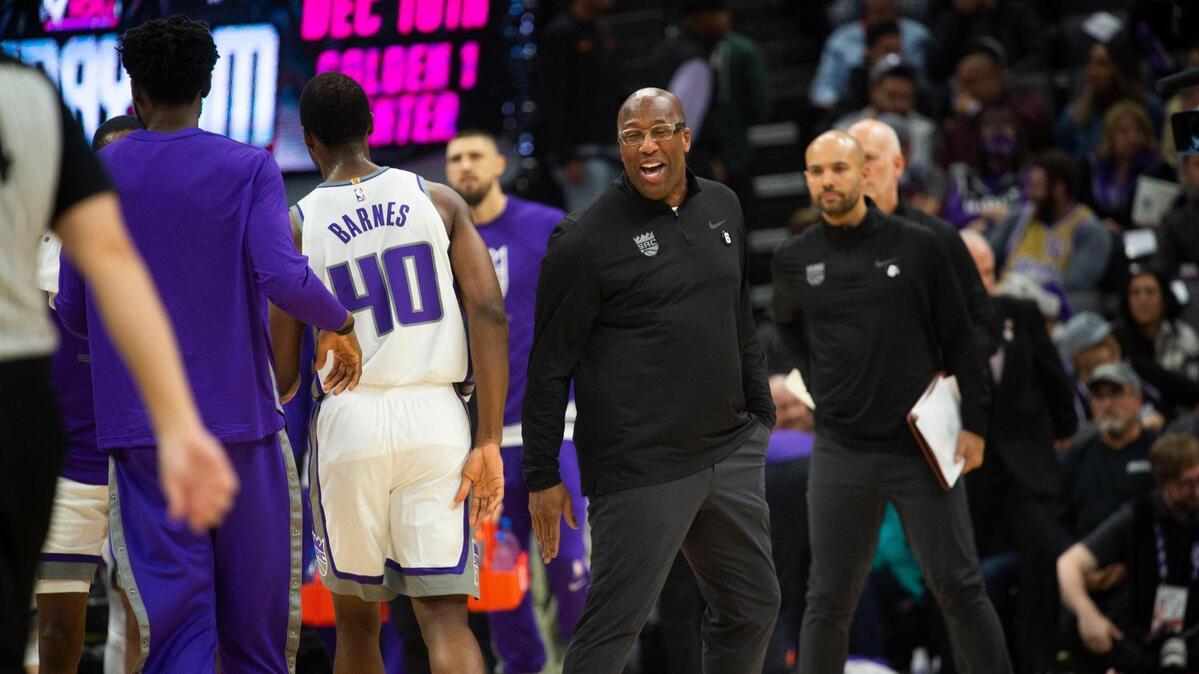 Mike Brown, Sacramento Kings head coach is all smiles after Sacramento Kings forward Harrison Barnes (40) scored a three point basket against the Chicago Bulls on Sunday during an NBA basketball game at Golden 1 Center in Sacramento.