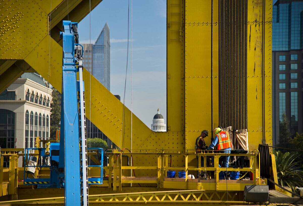 Workers replace the cables on the Tower Bridge om October 2018. Built in 1936, they have never been replaced before. The first full closure of the bridge is set for Sunday, Jan. 6.