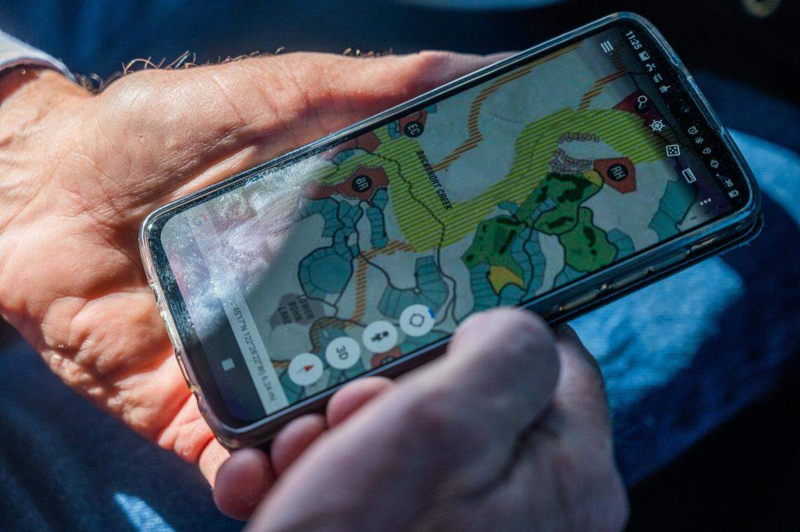 A map of the planned $1 billion Guenoc Valley development project is displayed on the phone of Randy Sternberg, who runs ranching operations on the property, in Lake County on April 12. Much of the property is in areas designated by Cal Fire as susceptible to wildfires.